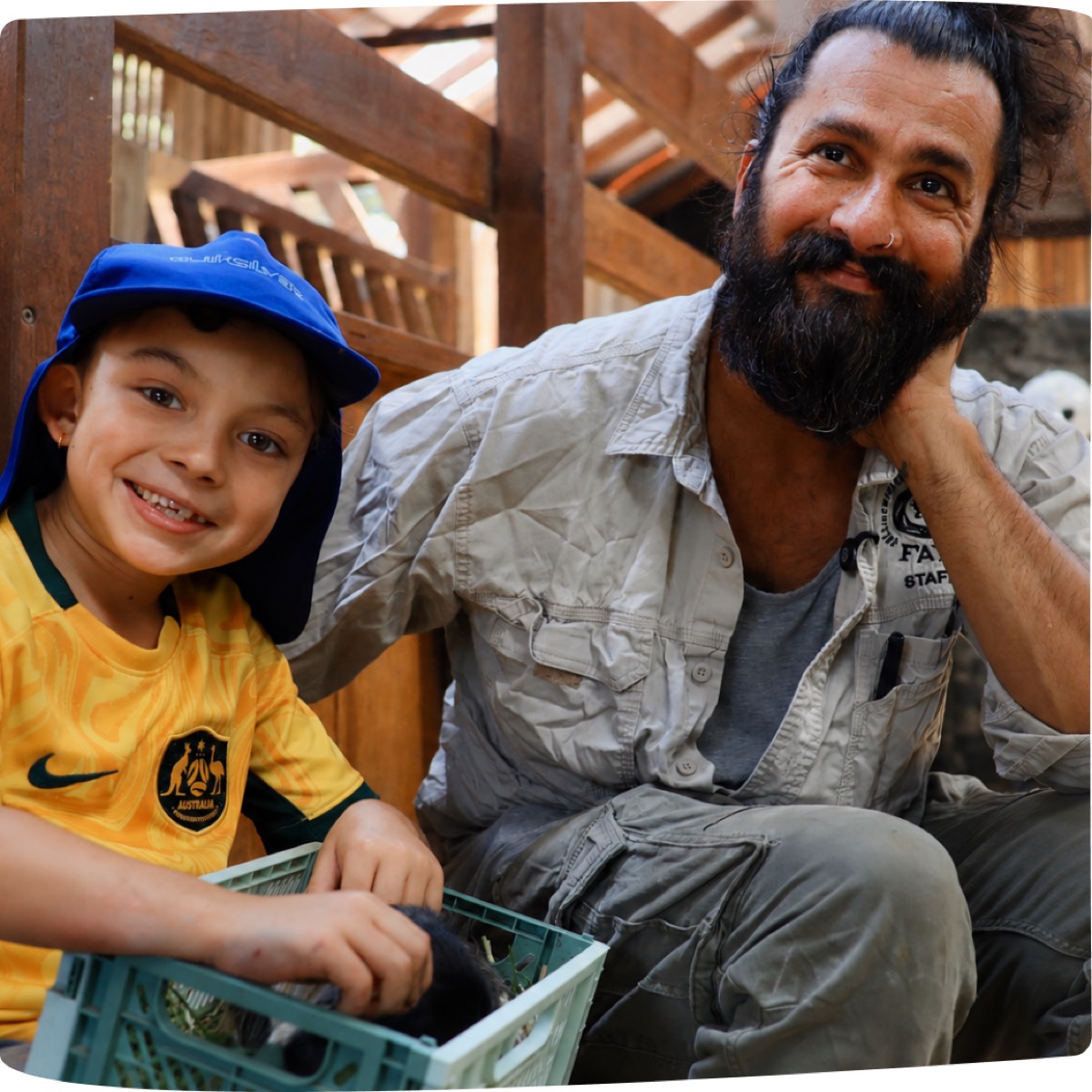 Child meeting a farm staff member at Collingwood Children's Farm